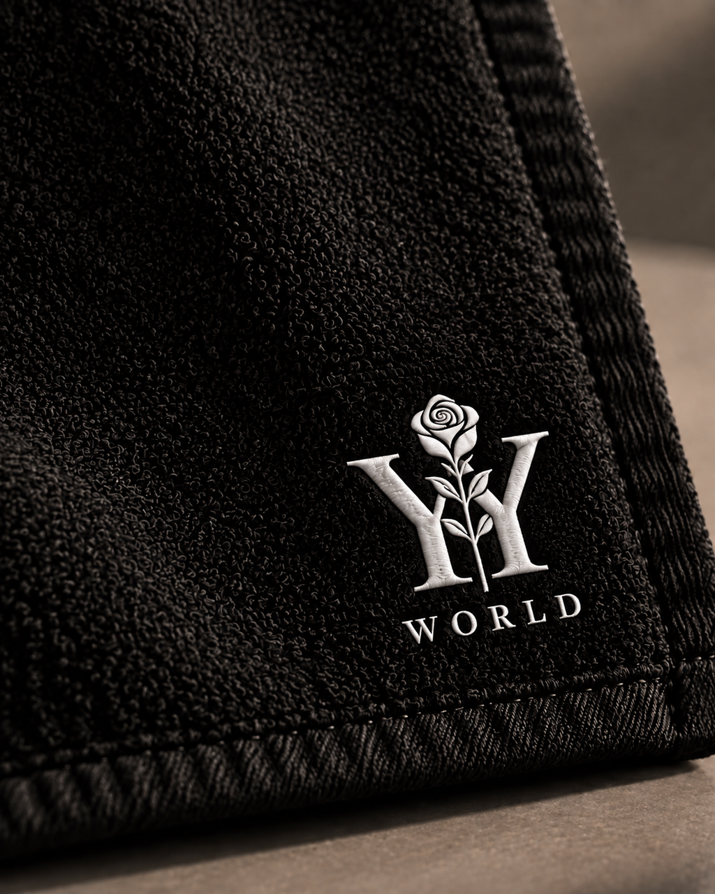 WORLD 001 Encore Towel — logo detail